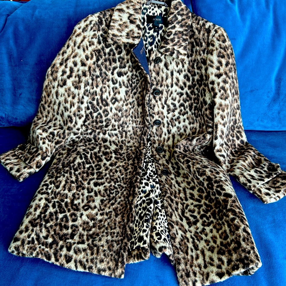 J Crew leopard print coat with interior polyester and placket lining .